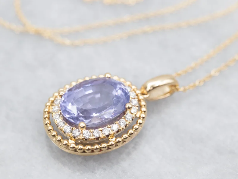 Serpentine stone necklaces-Modern Gold Sapphire Halo Pendant Necklace