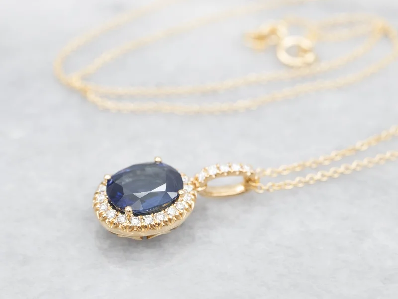 Fine filigree necklaces-Modern Gold Sapphire Halo Pendant Necklace