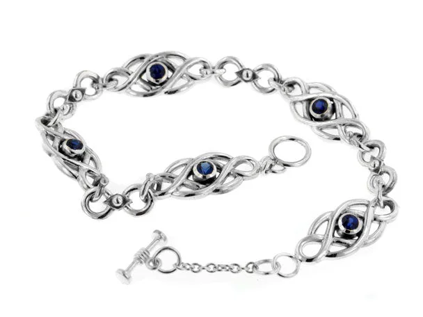 Faith charm bangles-Sterling Silver Dark Blue Sapphire Celtic Knot Bracelet, 7.5"